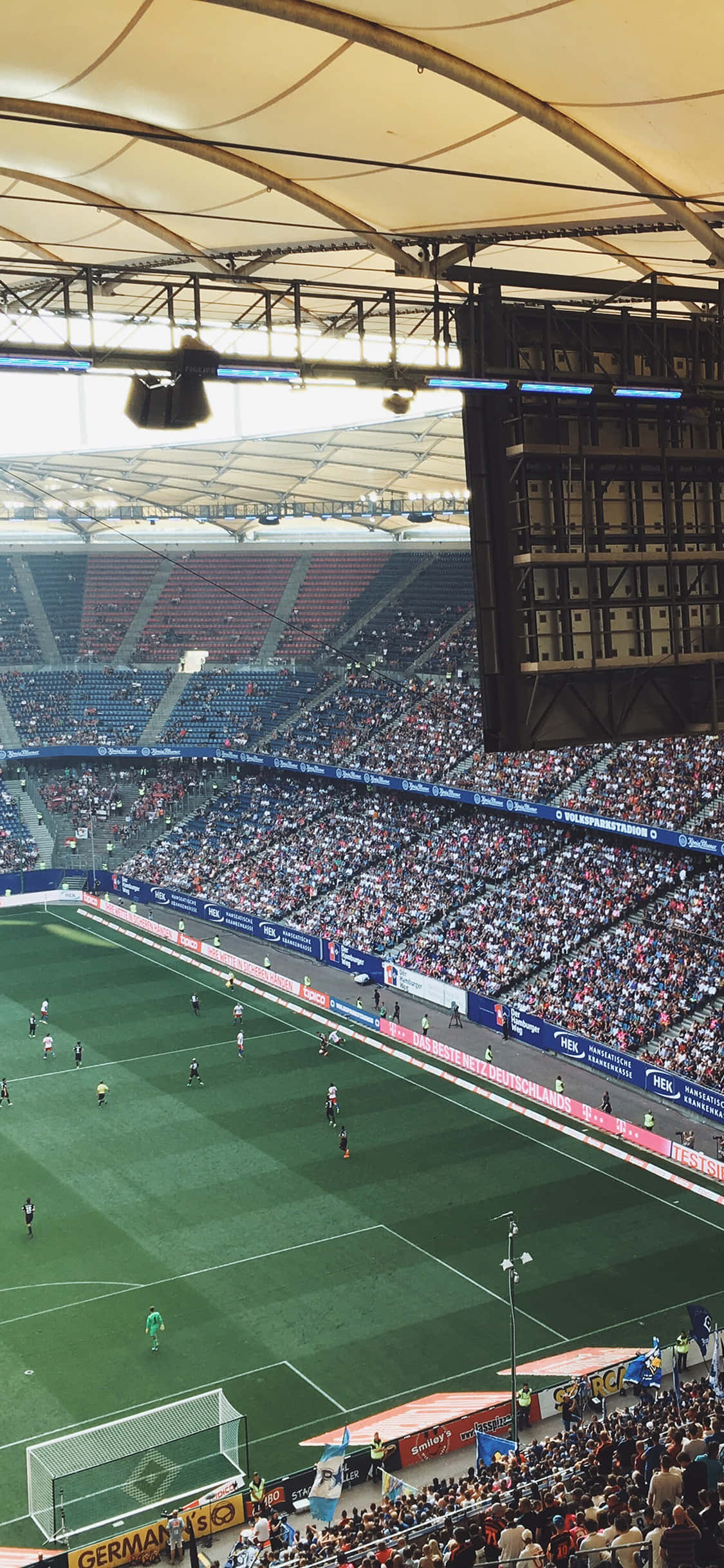 Futbol Stadyumu'nun elektrikli atmosferinin tadını çıkarın Duvar Kağıdı