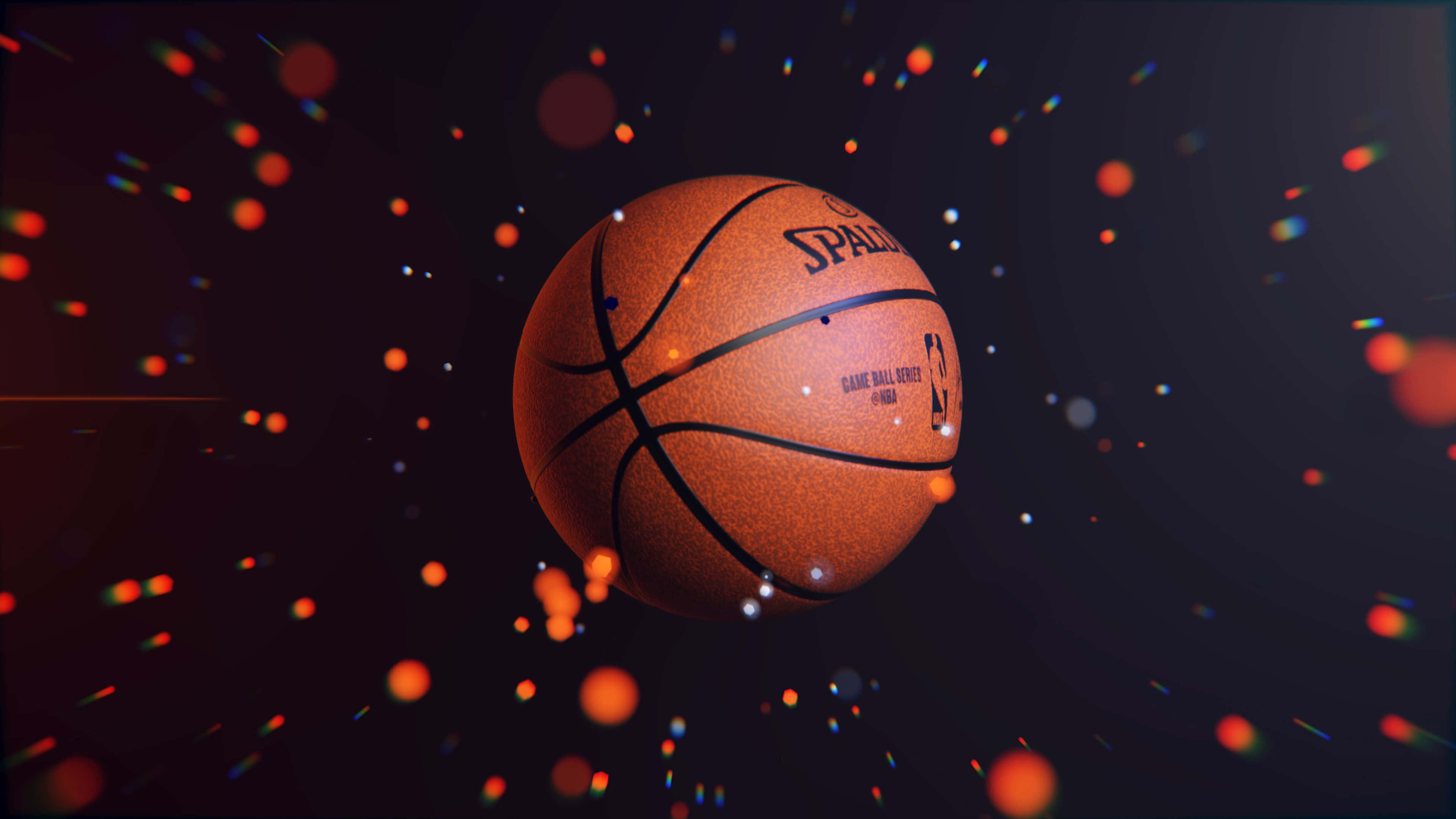 Turuncu ve kırmızı ışıklı bir basketbol topu Duvar Kağıdı
