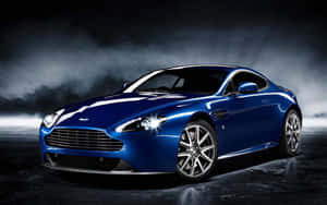Büyüleyici Aston Martin DB9 Manzaralı Bir Yolda Hareket Halinde — Steam Deck OLED Duvar Kağıdı