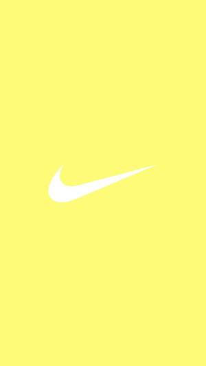 Büyüleyici Pastel Sarı Estetik ve İkonik Nike Logosu Sıçraması — Pastel Sarı Estetik Duvar Kağıdı