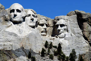 Güneş Rushmore Dağı'nda Parlıyor — Mavi Gökyüzü Duvar Kağıdı
