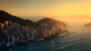 Gün batımında güzel Hong Kong şehir manzarası duvar kağıdı. — 1600x900 Duvar Kağıdı