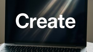 Minimalist bir MacBook duvar kağıdı üzerinde kalın harflerle 'Yarat' yazısı.