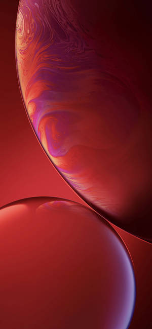 İki kırmızı dönen soyut baloncuktan oluşan iPhone XR duvar kağıdı